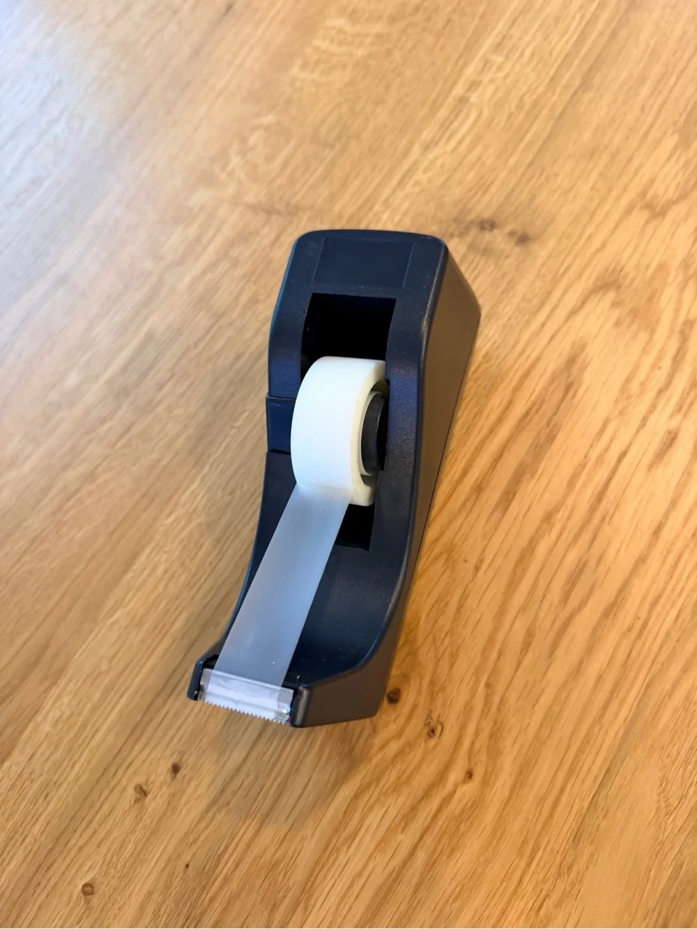 Black Desktop Tape Dispenser with White Roll of tape